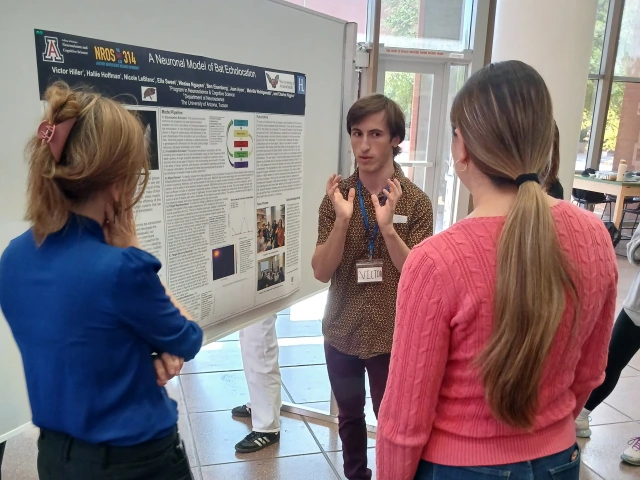 Students in front of poster