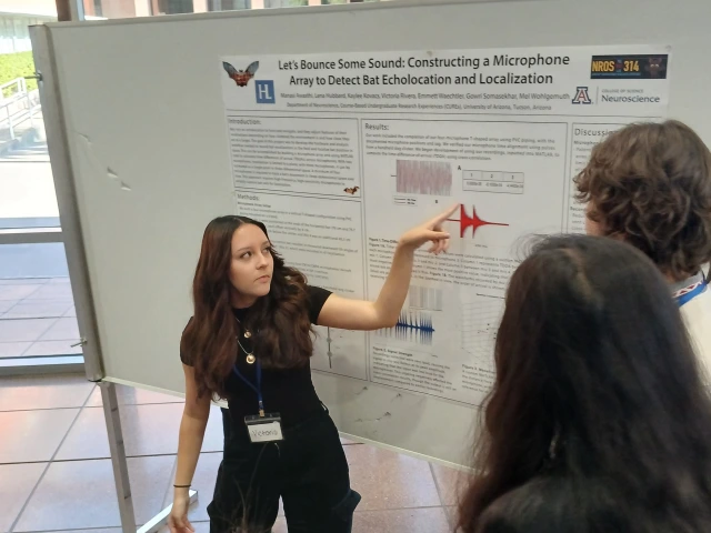 people in front of poster 