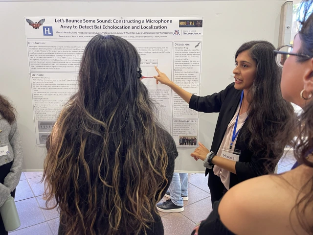 people in front of poster 