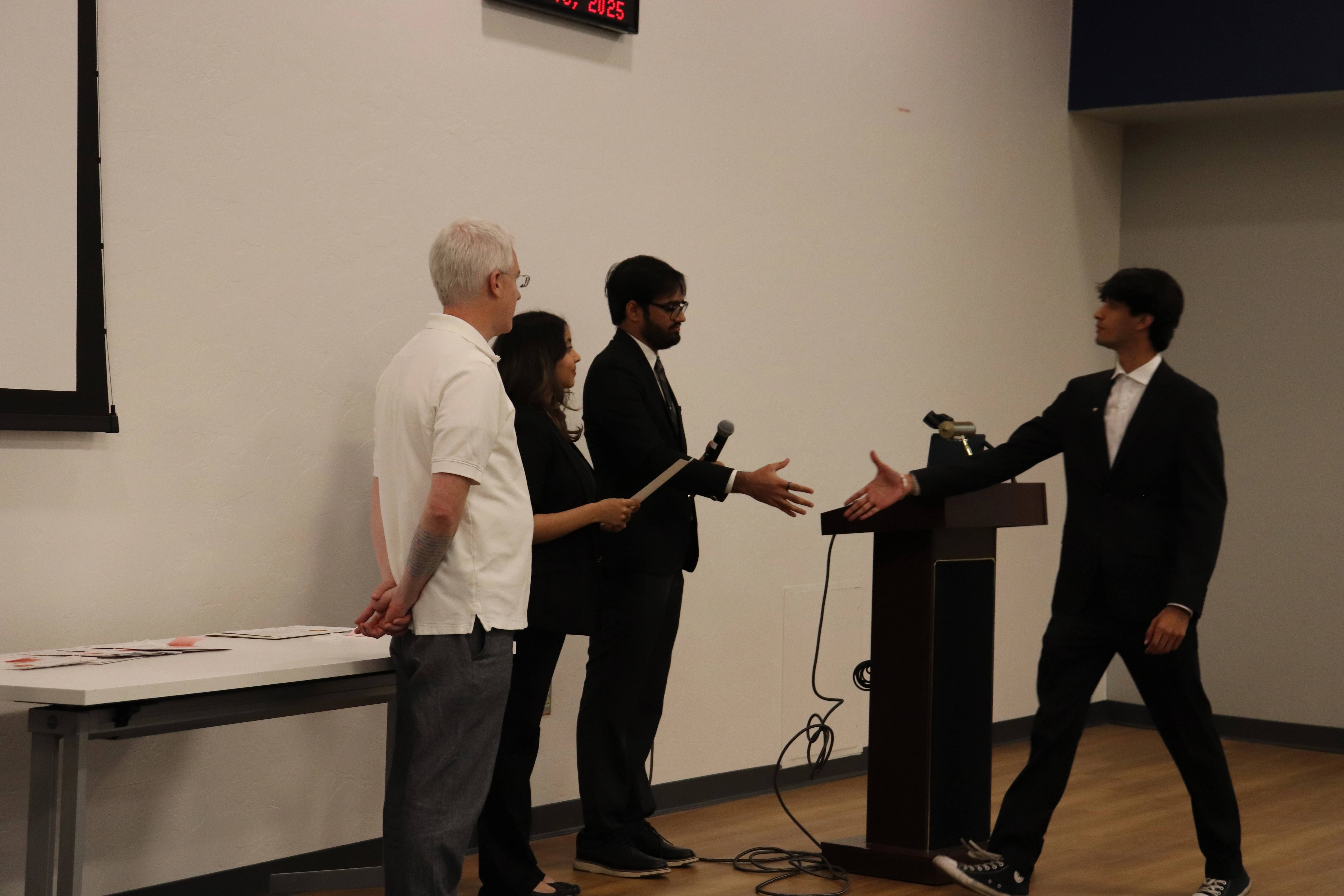 Undergraduate Student being inducted into the Nu Rho Psi Community