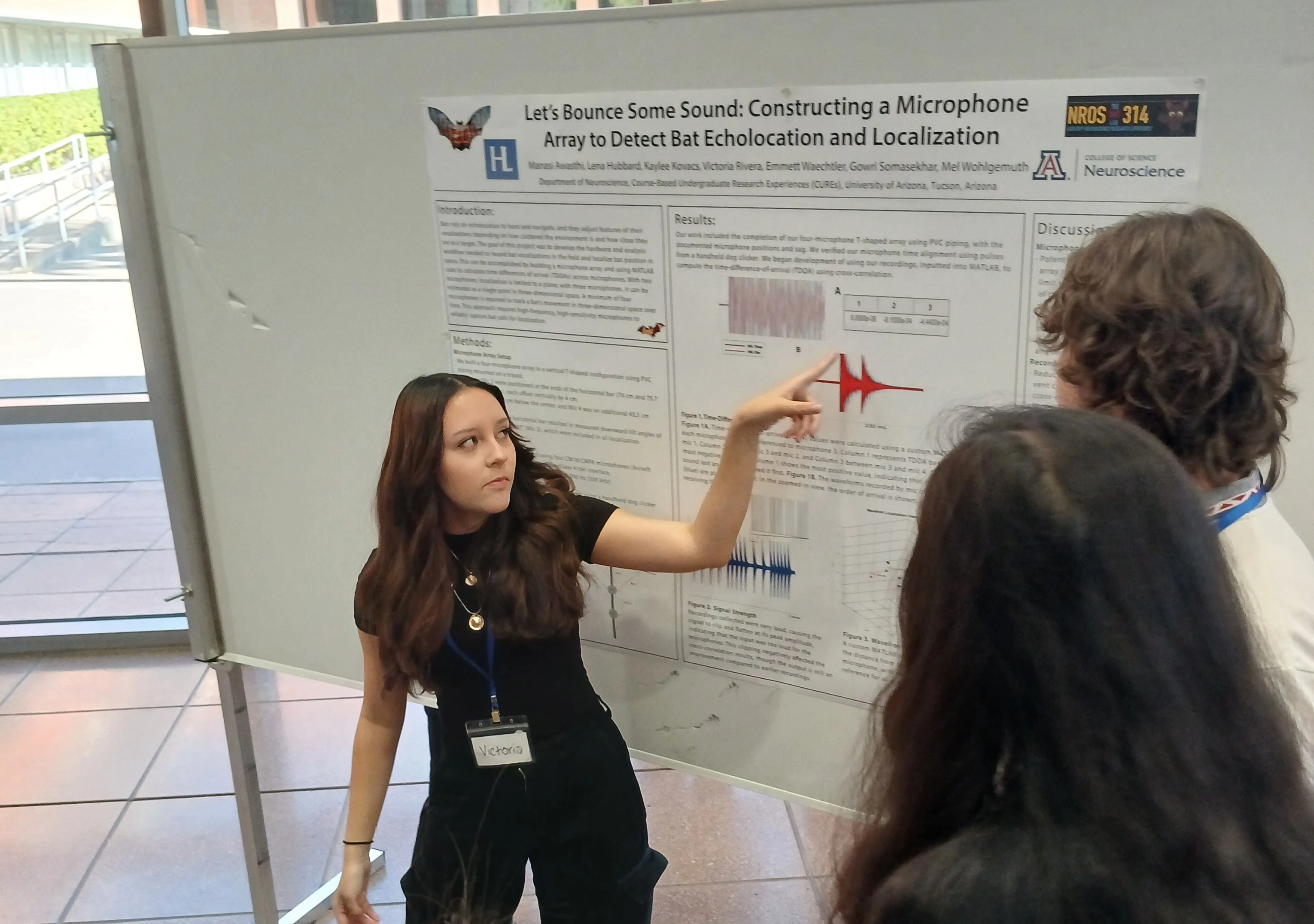 people in front of poster 